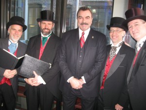 Gentlemen Carolers caroling with Tom Selleck at Blue Bloods Christmas Party